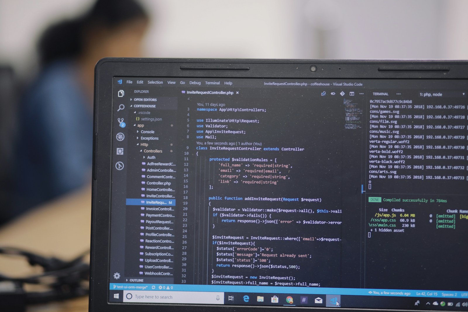 Builders working on laptops during a hackathon